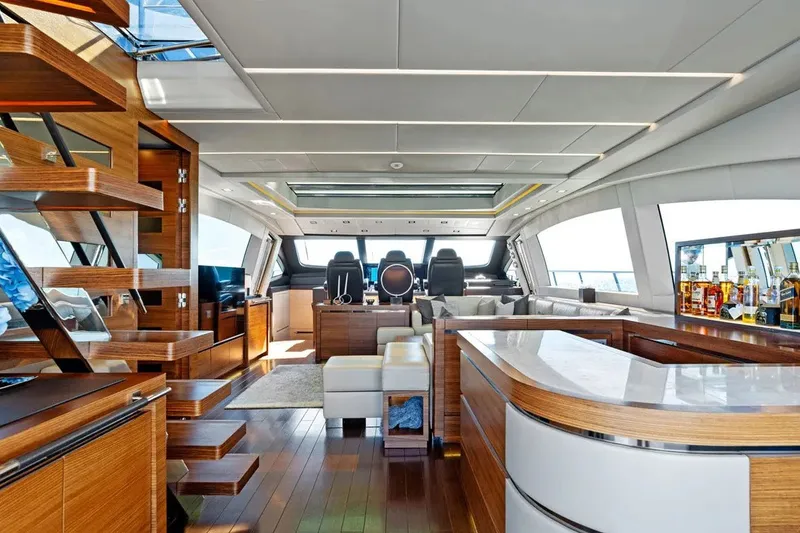 Slide: The Image of Luxurious interior of 2016 Mangusta 94 yacht with modern design and wooden accents. - 7