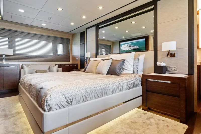 Slide: The Image of Luxurious bedroom interior on 2016 Mangusta 94 yacht, featuring elegant bedding and modern decor. - 9