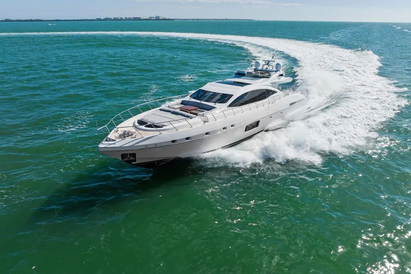 Slide: The Image of Luxurious 2016 Mangusta 94 yacht cruising swiftly on open sea waters. - 1