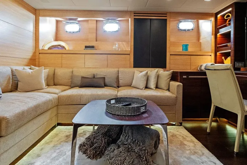 Slide: The Image of Luxurious interior of 2016 Mangusta 94 yacht with cozy seating and elegant decor. - 10