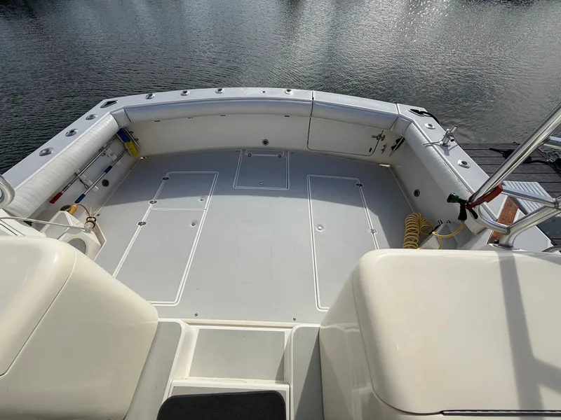 Slide: The Image of The image shows the spacious aft deck of a 1993 Rampage Express Sportfish boat. - 29