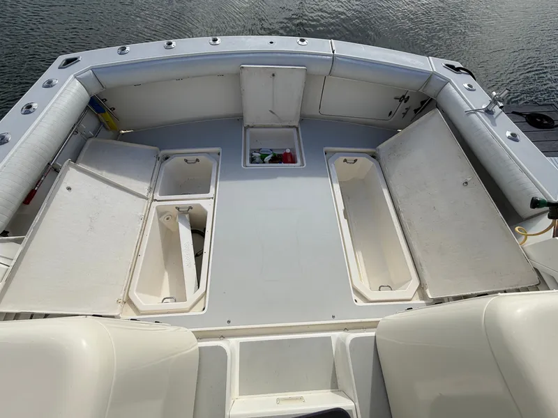Slide: The Image of The image shows the spacious stern of a 1993 Rampage Express Sportfish with multiple storage compartments. - 30