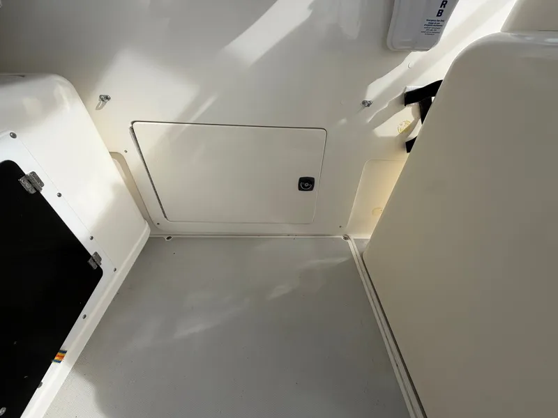 Slide: The Image of Interior of a 1993 Rampage Express Sportfish with white walls and flooring. - 42