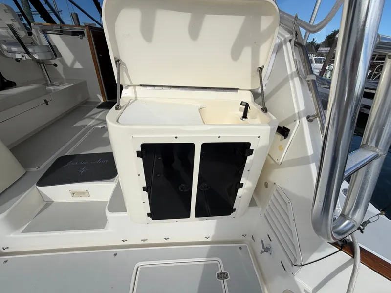 Slide: The Image of The image shows the cockpit of a 1993 Rampage Express Sportfish with a sink and storage. - 44