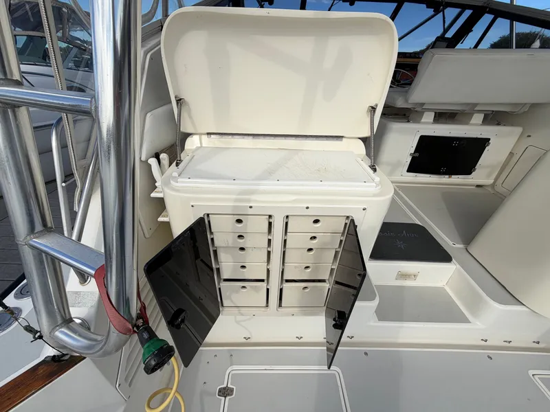 Slide: The Image of A 1993 Rampage Express Sportfish with open storage and drawers in the cockpit area. - 47