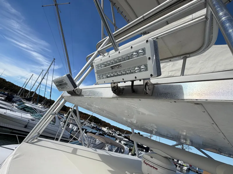 Slide: The Image of Close-up of a boat roof with mounted LED lights in a marina. - 28