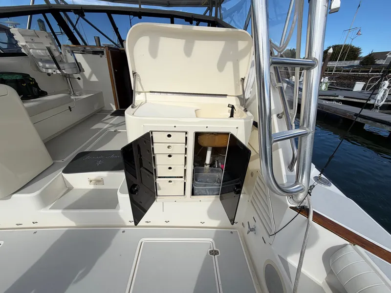 Slide: The Image of The image shows the cockpit of a 1993 Rampage Express Sportfish with storage and seating. - 45
