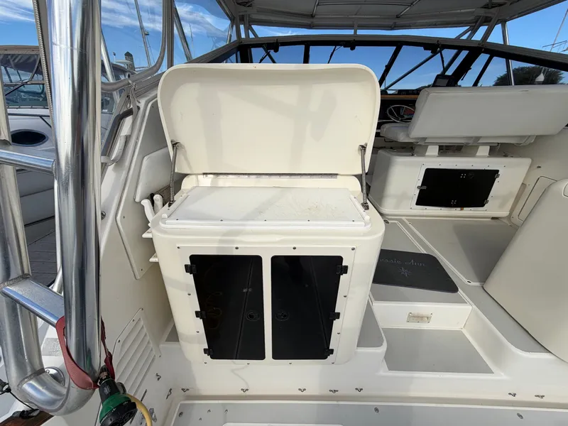 Slide: The Image of The image shows the cockpit of a 1993 Rampage Express Sportfish with storage and seating area. - 46