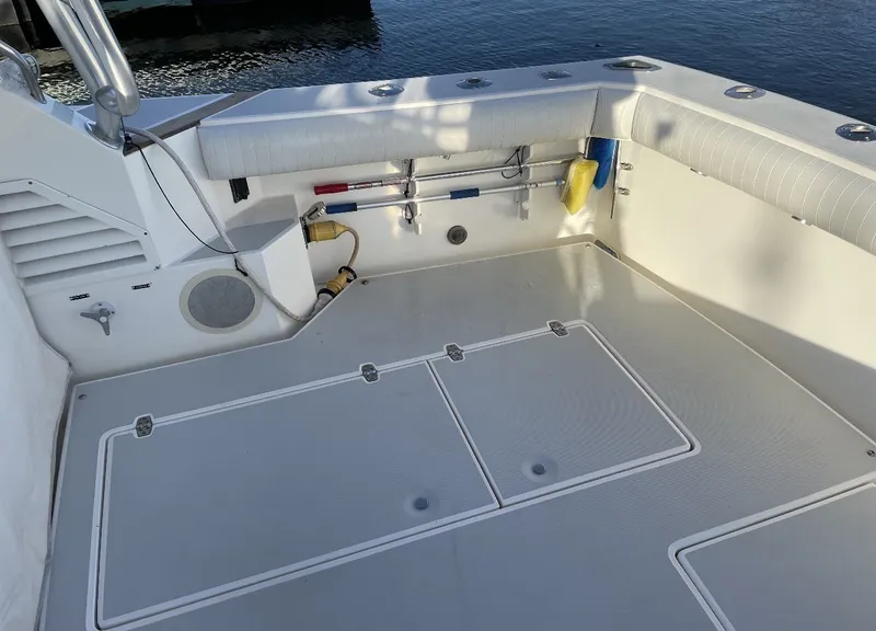 Slide: The Image of The image shows the cockpit of a 1993 Rampage Express Sportfish with padded seating and fishing rod holders. - 15