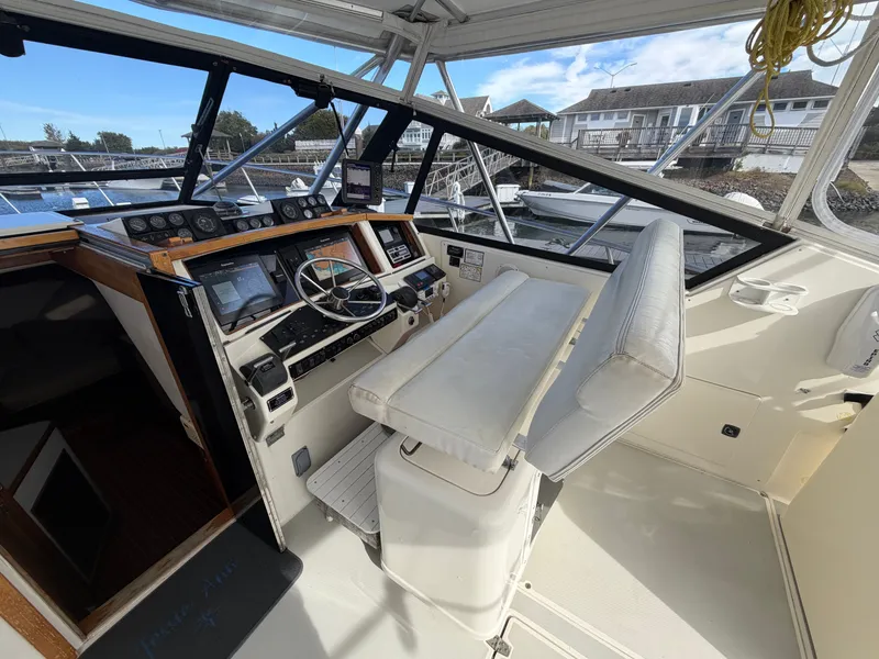 Slide: The Image of The cockpit of a 1993 Rampage Express Sportfish with helm and instruments. - 41