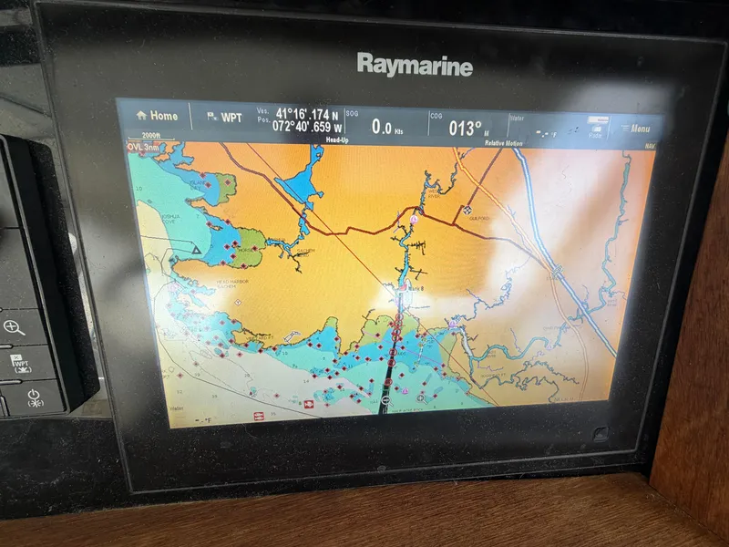 Slide: The Image of A Raymarine navigation system displays a detailed nautical chart with course information. - 39