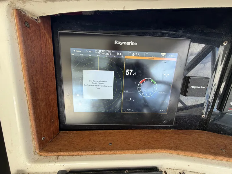 Slide: The Image of Raymarine navigation system on a 1993 Rampage Express Sportfish boat. - 36