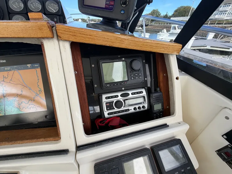 Slide: The Image of The cockpit of a 1993 Rampage Express Sportfish with navigation and communication equipment. - 37