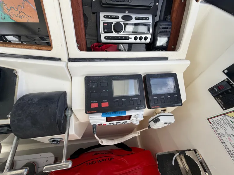 Slide: The Image of The cockpit of a 1993 Rampage Express Sportfish features navigation and communication equipment. - 38