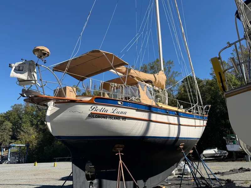 Slide: The Image of A 1983 Union Cutter is on a dry dock, surrounded by trees and clear sky. - 24