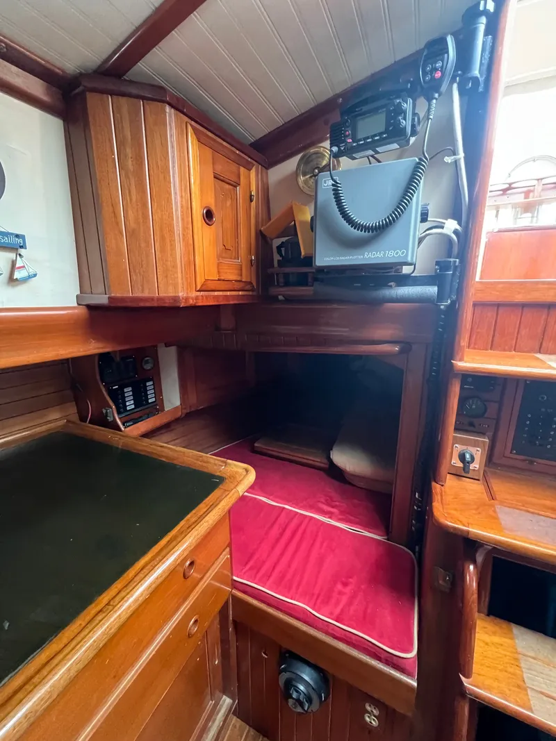 Slide: The Image of Interior of a 1983 Union Cutter with wood finish and red cushion. - 15