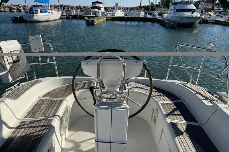 Slide: The Image of Cockpit view of 2004 Jeanneau Sun Odyssey 37 sailboat docked in marina. - 3