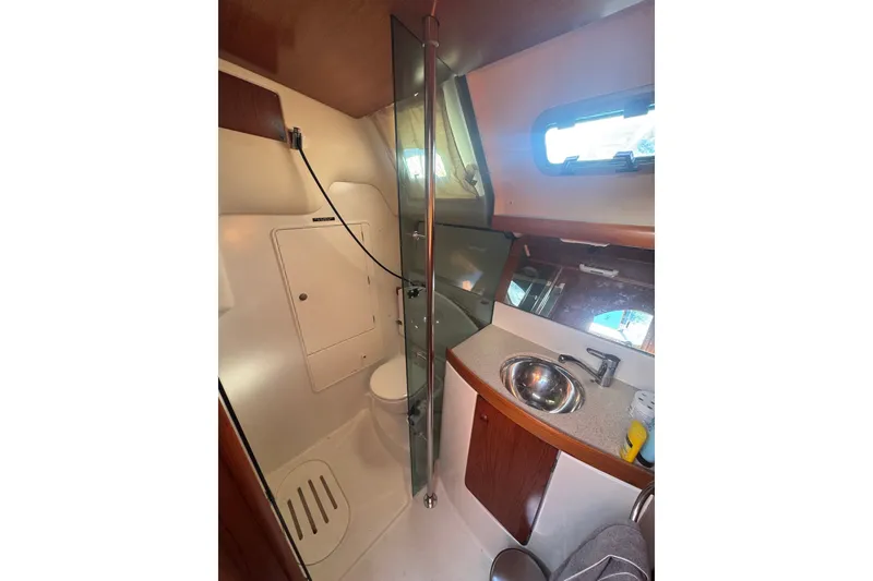 Slide: The Image of Bathroom interior of 2004 Jeanneau Sun Odyssey 37 yacht, featuring sink and shower. - 12