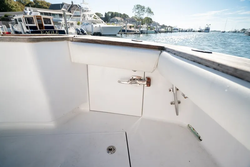 Slide: The Image of The image shows the cockpit of a 2017 Lightning Custom Yachts 37 Express Sportfish overlooking a marina. - 24
