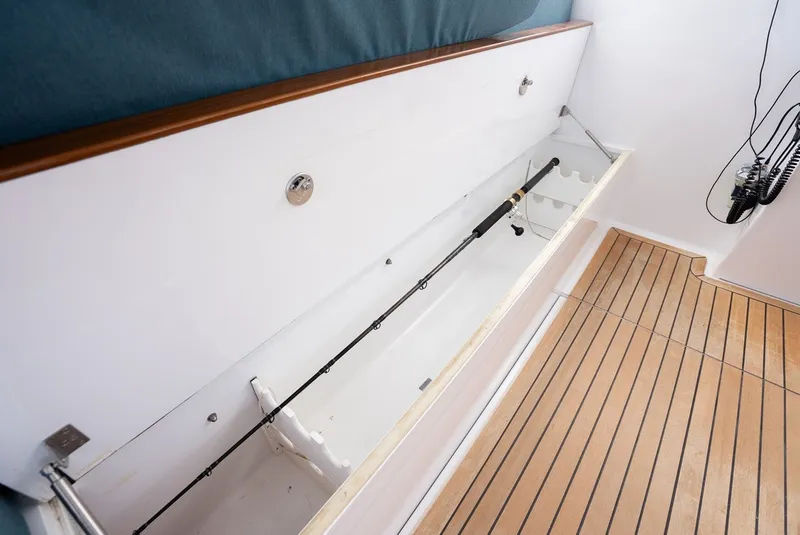 Slide: The Image of Fishing rod compartment on a 2017 Lightning Custom Yachts 37 Express Sportfish. - 35