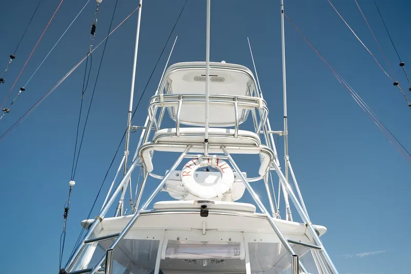 Slide: The Image of A 2017 Lightning Custom Yachts 37 Express Sportfish with a tall aluminum tower and life ring. - 21