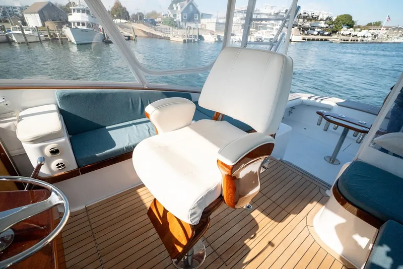 Slide: The Image of A luxurious seat on a sportfish boat overlooking a calm harbor. - 30