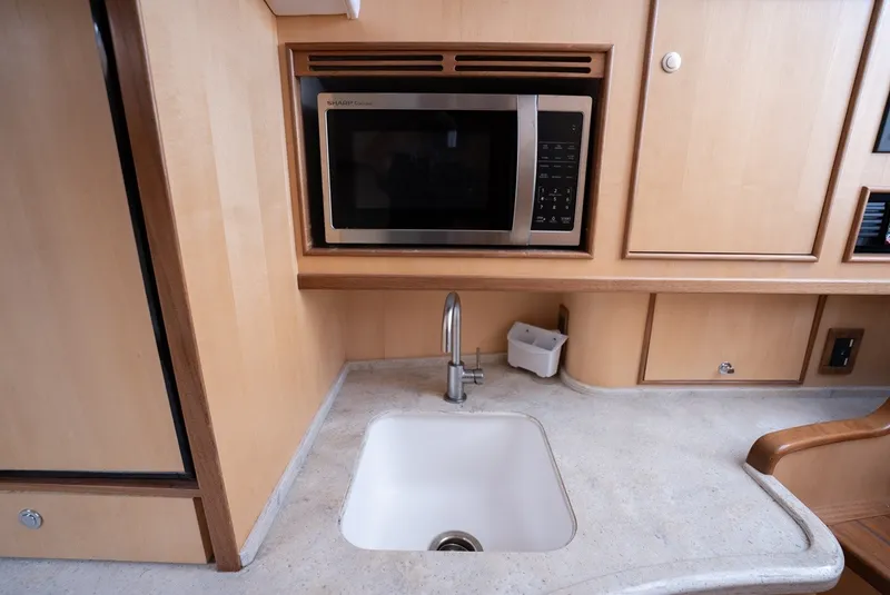 Slide: The Image of Galley area with a sink and microwave in a yacht. - 47
