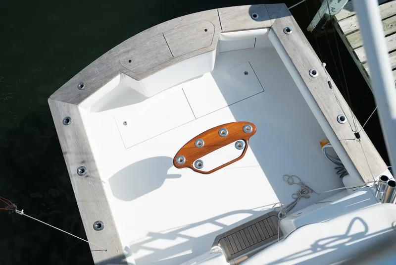 Slide: The Image of The image shows the cockpit of a 2017 Lightning Custom Yachts 37 Express Sportfish with wood accents. - 42