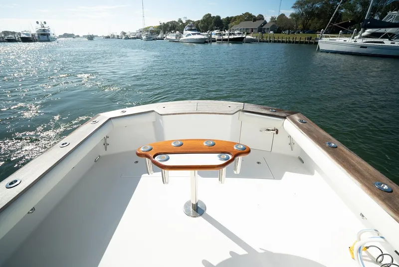 Slide: The Image of The aft deck of a 2017 Lightning Custom Yachts 37 Express Sportfish with rod holders. - 16