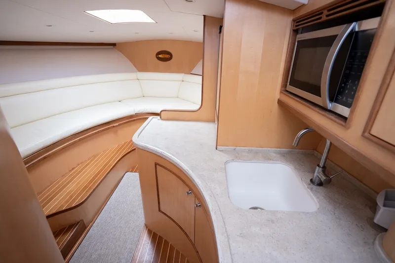 Slide: The Image of Interior of the 2017 Lightning Custom Yachts 37 Express Sportfish with sleek kitchen and seating area. - 44