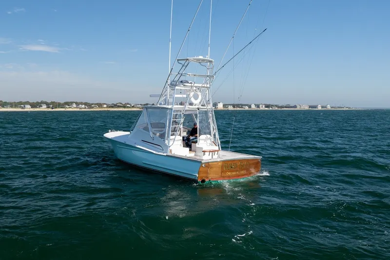 Slide: The Image of A 2017 Lightning Custom Yachts 37 Express Sportfish on the water with clear skies. - 10