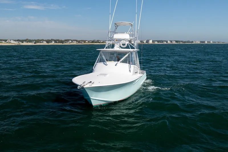 Slide: The Image of 2017 Lightning Custom Yachts 37 Express Sportfish on the water, with a clear view of the deck. - 7