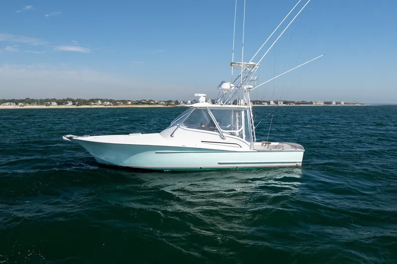 Slide: The Image of A 2017 Lightning Custom Yachts 37 Express Sportfish on open water with clear skies. - 15