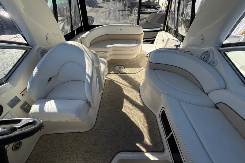 Slide: The Image of 2008 Sea Ray Sundancer 260 interior with plush seating and elegant design. - 18