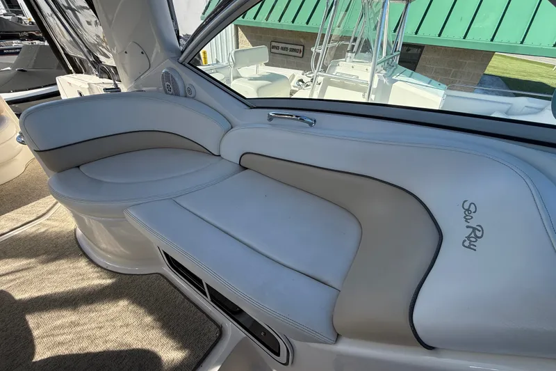 Slide: The Image of Interior seating of 2008 Sea Ray Sundancer 260 boat with white upholstery. - 19