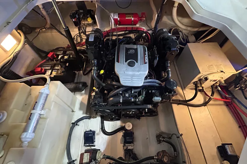 Slide: The Image of Engine compartment of a 2008 Sea Ray Sundancer 260 boat, showcasing the engine and components. - 39