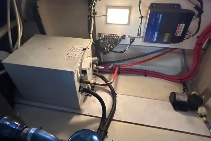 Slide: The Image of Engine compartment of a 2008 Sea Ray Sundancer 260 with wiring and components. - 41