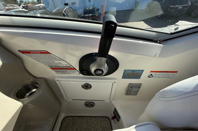 Slide: The Image of Control panel of a 2008 Sea Ray Sundancer 260 boat cockpit. - 15
