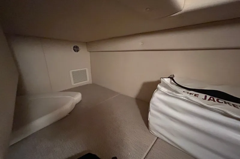 Slide: The Image of Interior cabin of 2008 Sea Ray Sundancer 260 with life jacket storage. - 38