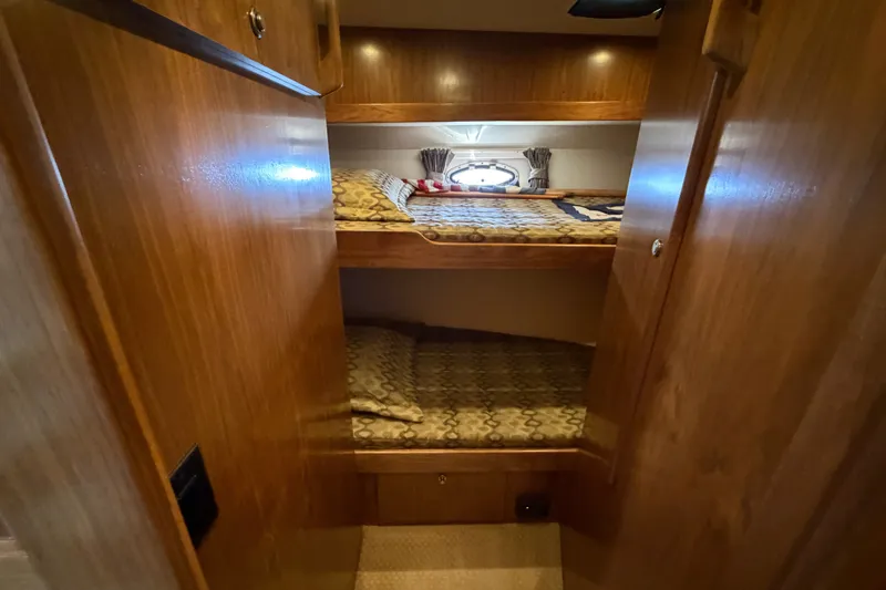 Slide: The Image of Cozy wooden bunk beds in 2009 Navigator 5800 Pilothouse MY yacht cabin. - 17