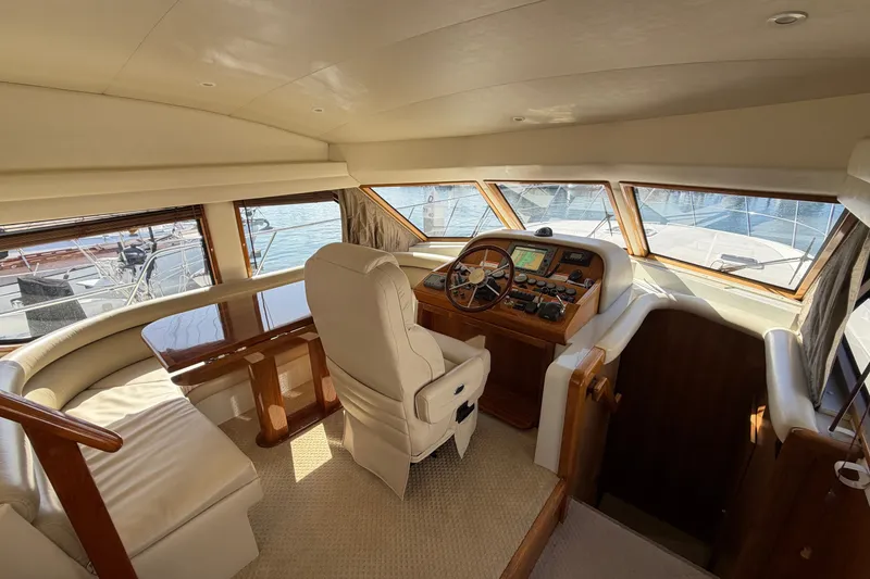Slide: The Image of Luxurious 2009 Navigator 5800 Pilothouse MY yacht interior with helm and seating area. - 12