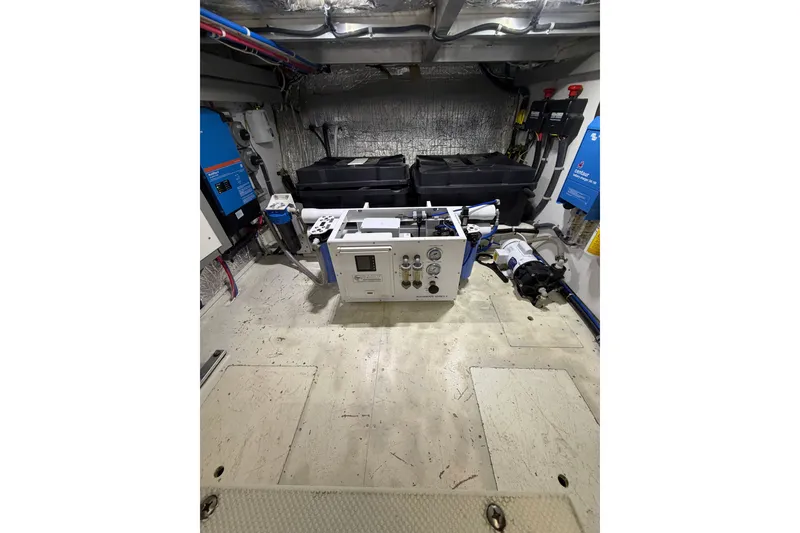 Slide: The Image of Engine room of 2009 Navigator 5800 Pilothouse MY with equipment and control panels. - 28