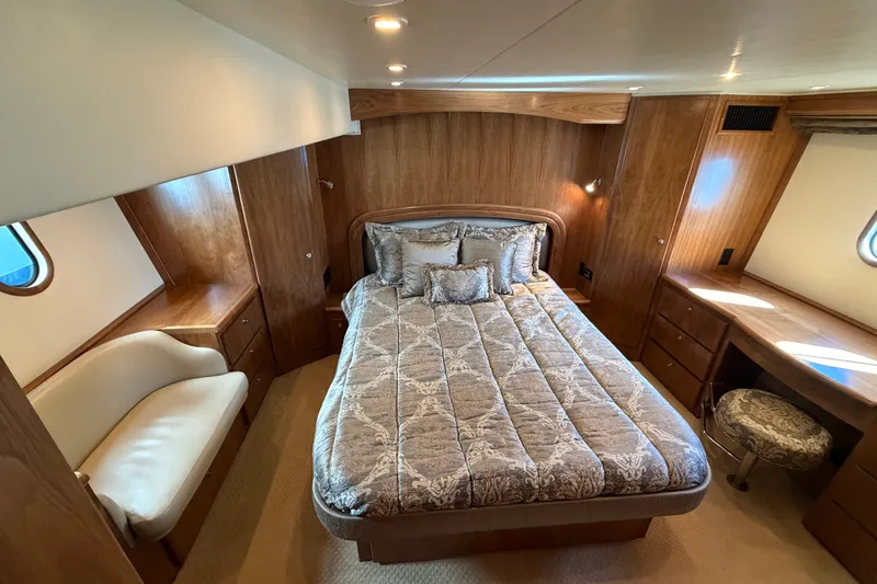 Slide: The Image of Luxurious bedroom in 2009 Navigator 5800 Pilothouse MY yacht with elegant wood finish. - 13