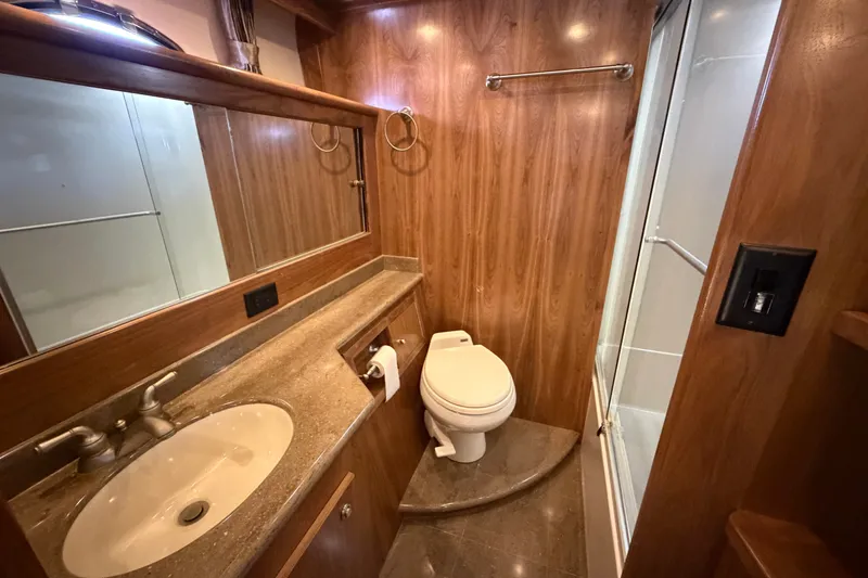 Slide: The Image of Luxurious bathroom in 2009 Navigator 5800 Pilothouse MY yacht with wood paneling and modern fixtures. - 18