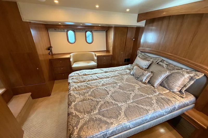 Slide: The Image of Luxurious bedroom in 2009 Navigator 5800 Pilothouse MY yacht with elegant bedding and wood paneling. - 14