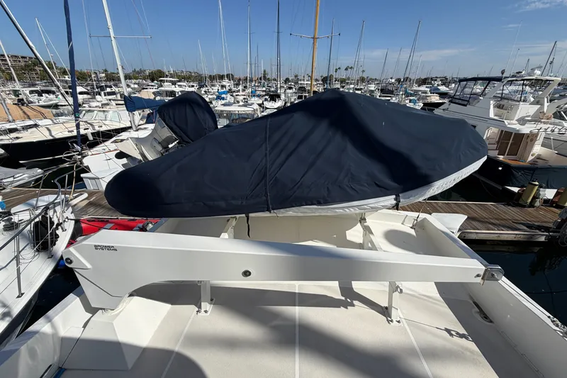 Slide: The Image of 2009 Navigator 5800 Pilothouse MY yacht with covered equipment at marina. - 30