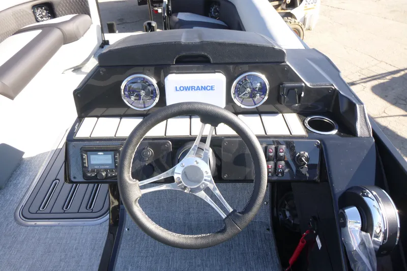 Slide: The Image of Cockpit of 2027 Premier 250 SUNSATION RLO - CL boat with steering wheel and controls. - 22