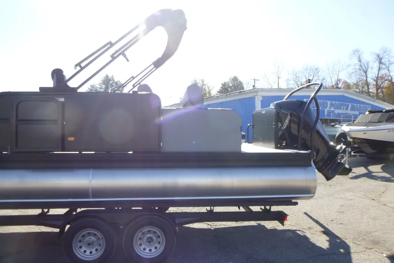 Slide: The Image of 2027 Premier 250 SUNSATION RLO - CL pontoon boat on trailer, outdoor setting. - 11