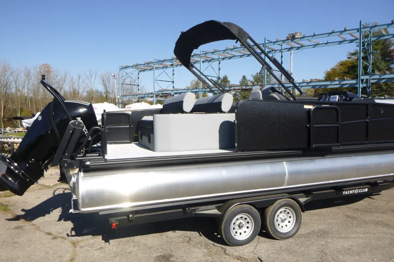 Slide: The Image of 2027 Premier 250 SUNSATION RLO - CL pontoon boat on trailer, outdoor setting. - 3