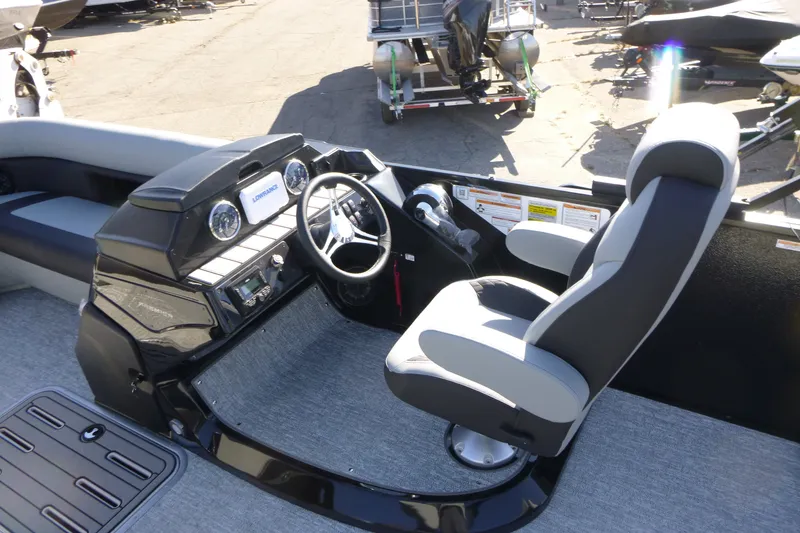 Slide: The Image of Premier 250 SUNSATION RLO - CL 2027 boat interior with steering console and captain's chair. - 21